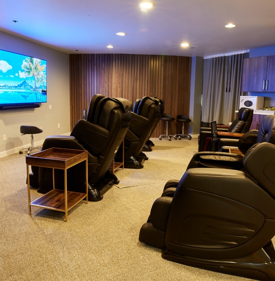 View of a large room full of massage chairs at Biohackr Health