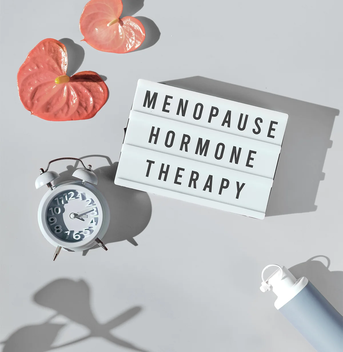 menopause hormone therapy sign next to alarm clock