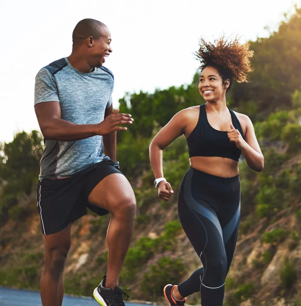 happy athletic couple jogging